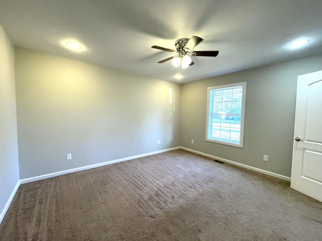 carpeted empty room with ceiling fan