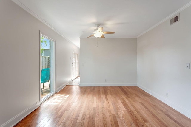 empty room featuring ceiling fan, crown molding, and light hardwood / wood-style floors