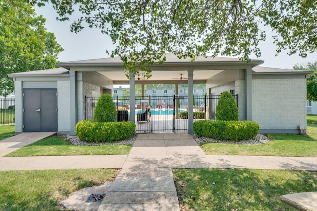 exterior space with a fenced in pool and a patio area