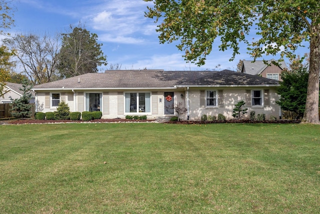 single story home featuring a front lawn