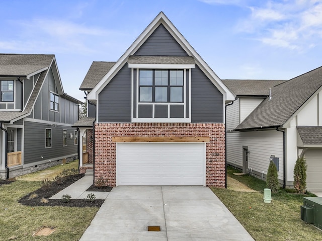 view of front of home with a front yard and a garage