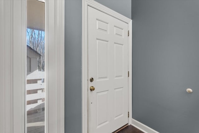 entryway with dark wood-type flooring