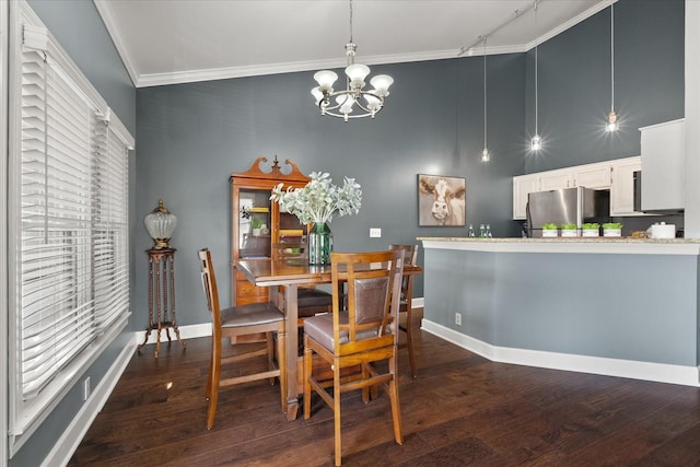 dining area featuring a chandelier, dark hardwood / wood-style flooring, crown molding, and track lighting