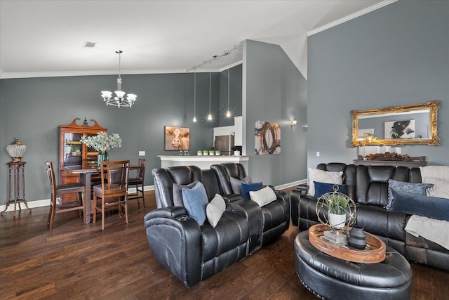 living room featuring an inviting chandelier, wood-type flooring, and ornamental molding