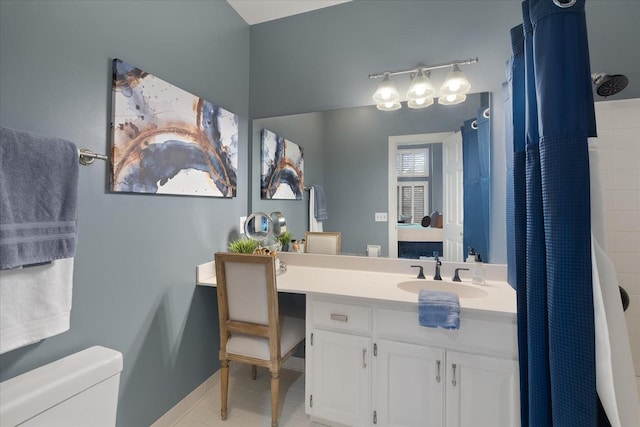 bathroom featuring tile patterned flooring, a shower with curtain, vanity, and toilet