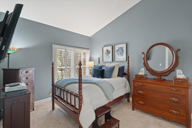 carpeted bedroom featuring lofted ceiling