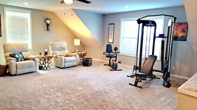 workout area featuring carpet floors, a healthy amount of sunlight, ceiling fan, and vaulted ceiling