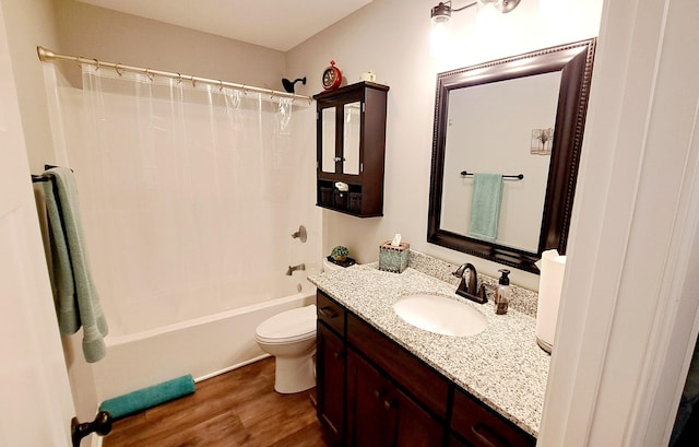 full bathroom featuring toilet, shower / bathtub combination with curtain, hardwood / wood-style floors, and vanity