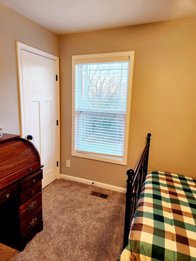 bedroom with light carpet