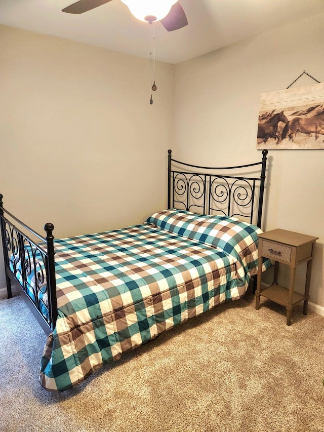 bedroom with ceiling fan and carpet floors