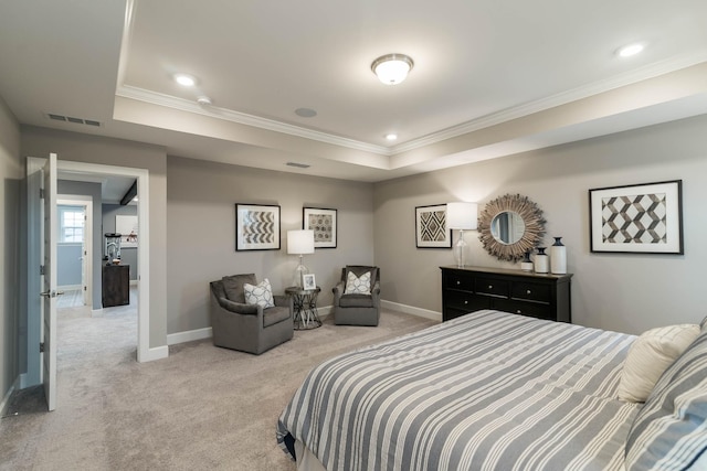 carpeted bedroom with a raised ceiling and ornamental molding