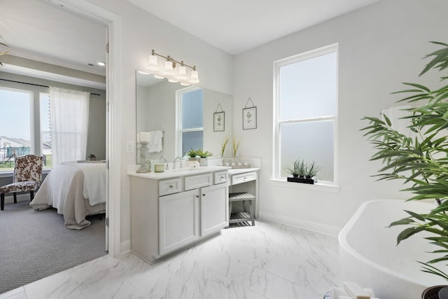 full bathroom featuring vanity, baseboards, a soaking tub, marble finish floor, and connected bathroom