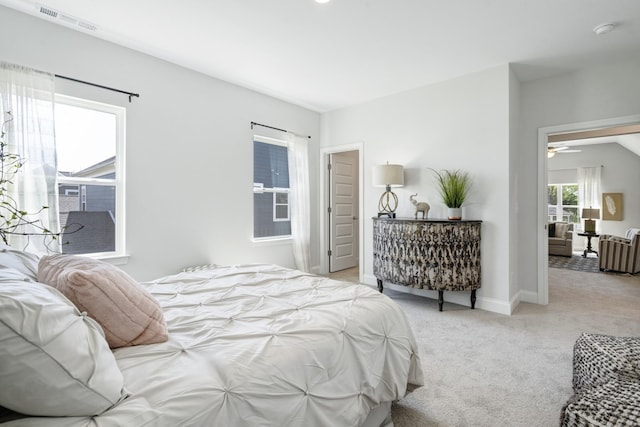 carpeted bedroom with baseboards and visible vents