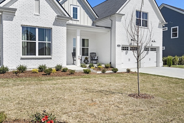 view of front facade with a front yard and a garage