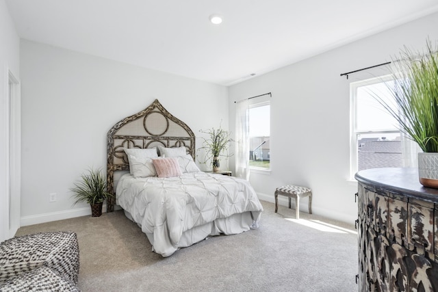 carpeted bedroom with baseboards