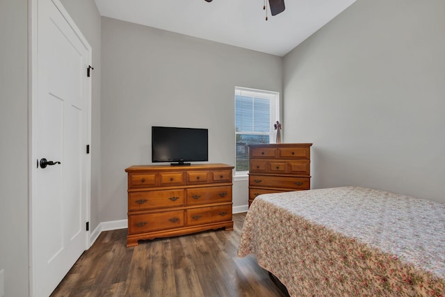 bedroom with ceiling fan and dark hardwood / wood-style flooring