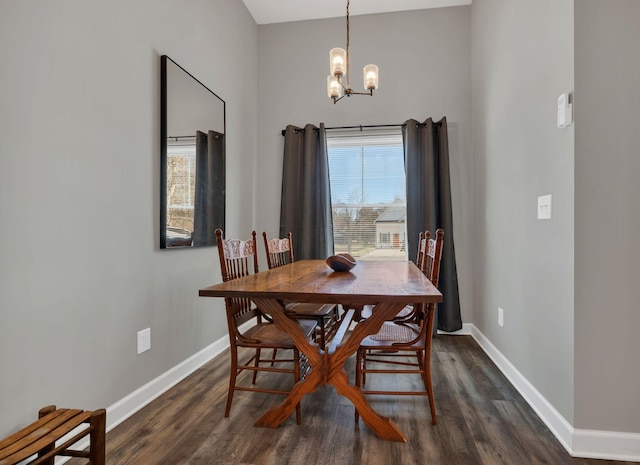 dining area featuring a chandelier and dark hardwood / wood-style floors