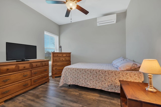 bedroom with a wall mounted air conditioner, dark hardwood / wood-style flooring, and ceiling fan