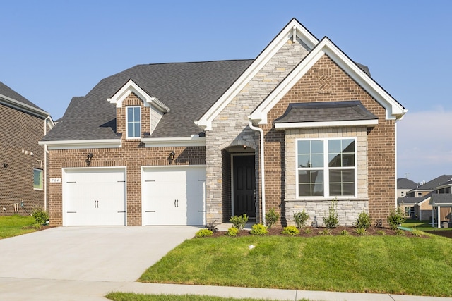 craftsman-style house with a front yard and a garage