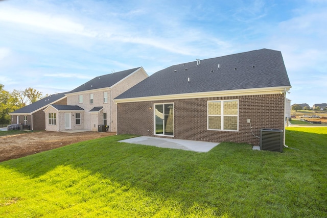 back of house featuring a lawn, central air condition unit, and a patio