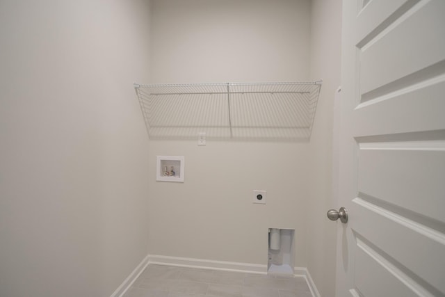 laundry room featuring washer hookup, light tile patterned floors, and electric dryer hookup