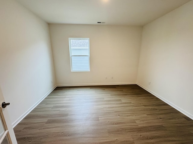 spare room featuring hardwood / wood-style floors