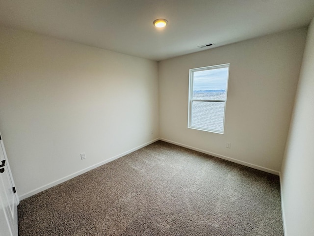 unfurnished room featuring carpet flooring