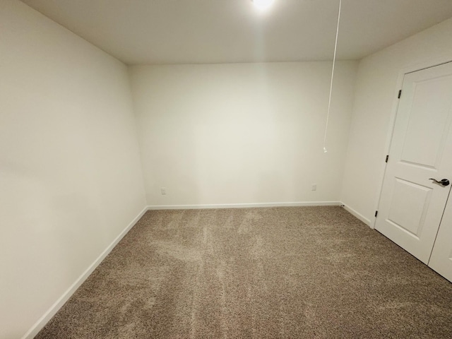 spare room featuring carpet floors