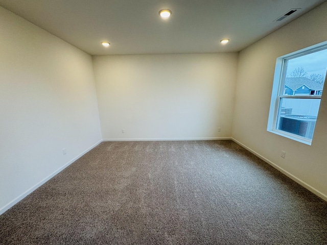 spare room featuring carpet flooring