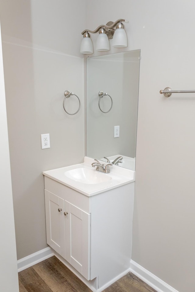 bathroom featuring vanity and hardwood / wood-style flooring