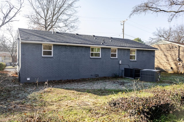 rear view of property featuring central AC