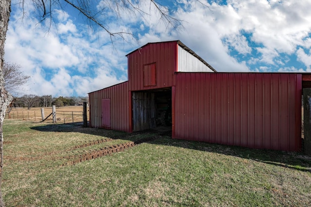 view of outdoor structure featuring a lawn