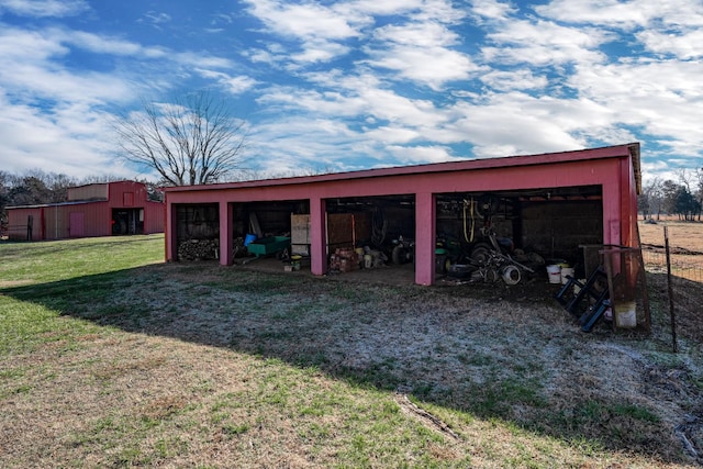 view of outbuilding featuring a yard