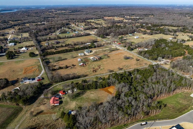 birds eye view of property with a rural view