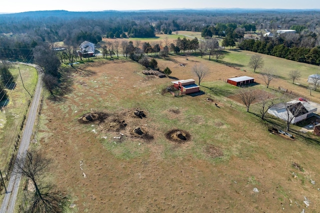 birds eye view of property with a rural view