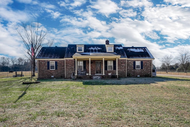 view of front of house with a porch and a front yard