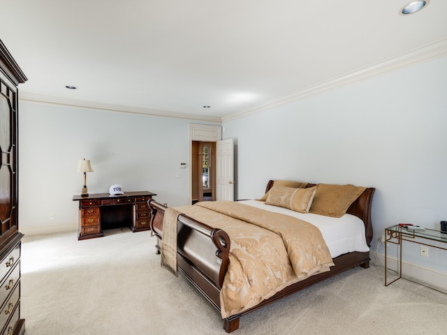 bedroom featuring crown molding and light carpet