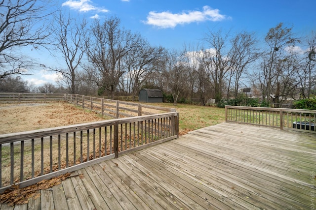 wooden deck with a storage shed