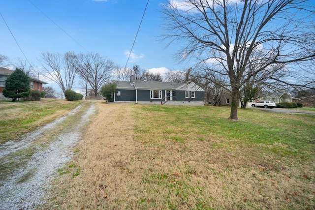 ranch-style home with a front yard