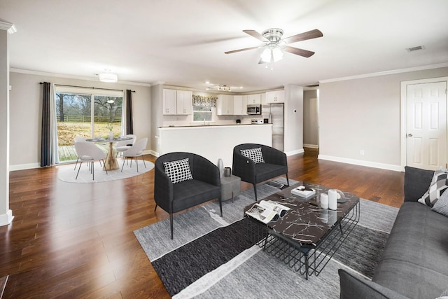 living room with crown molding, ceiling fan, and dark hardwood / wood-style flooring