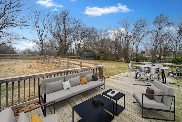 deck featuring an outdoor hangout area and a shed