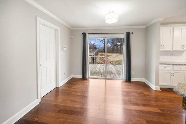 unfurnished dining area featuring crown molding and dark hardwood / wood-style flooring