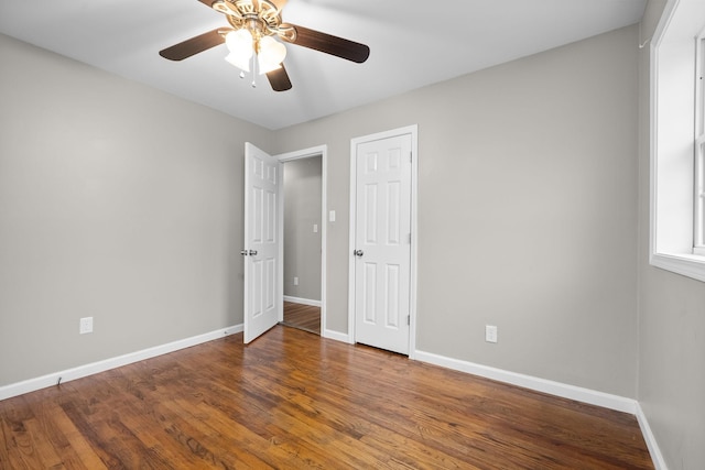 unfurnished bedroom with ceiling fan and hardwood / wood-style flooring