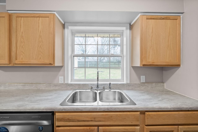 kitchen with a wealth of natural light, dishwasher, sink, and light brown cabinets