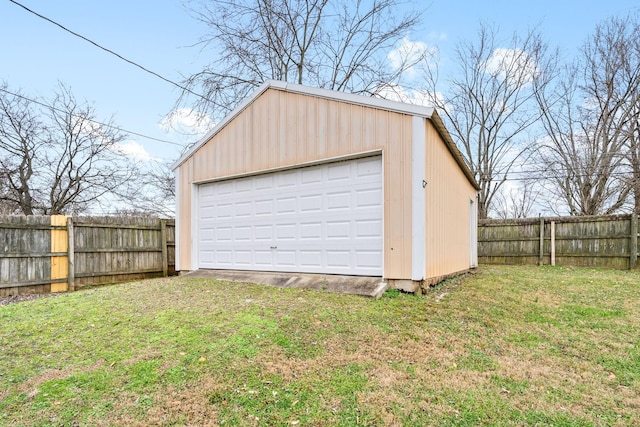 garage featuring a yard