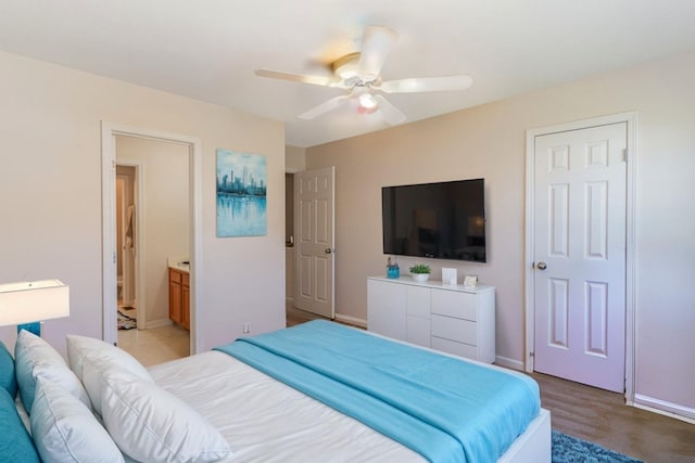 bedroom featuring ensuite bath and ceiling fan