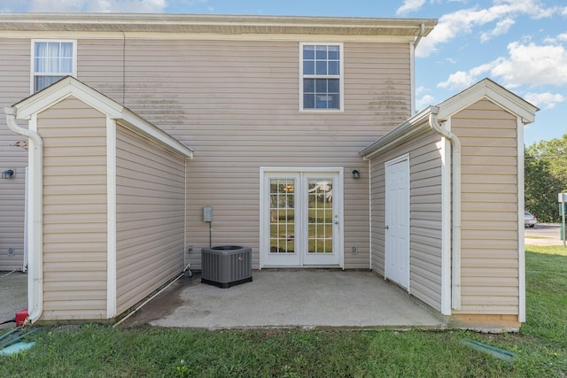 rear view of house featuring central AC and a patio area