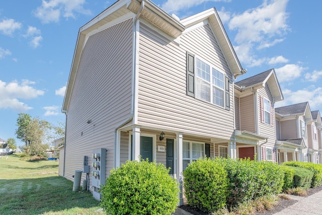 view of property exterior with a yard