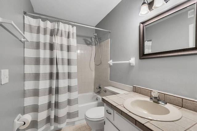 full bathroom featuring vanity, toilet, and shower / tub combo with curtain