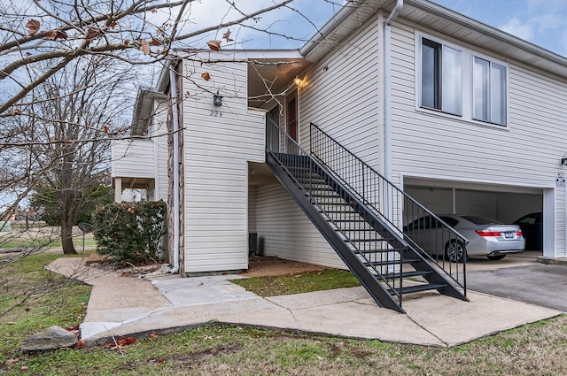 view of side of home featuring a garage